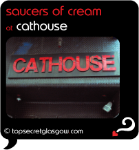 Top Secret Glasgow Quote Bubble, exterior photo of main door.
Caption: saucers of cream