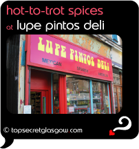 Top Secret Quote Bubble in black, with exterior shot of shop front. Caption: 'hot to trot spices at'