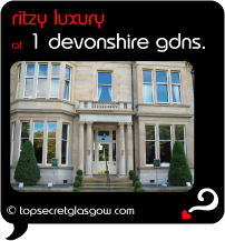 Top Secret Quote Bubble in black, with photo of front facade, in the sun. Caption: 'ritzy luxury'