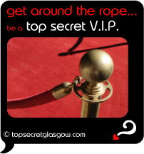 Top Secret Quote Bubble in black, with red velvet rope on gilded post.