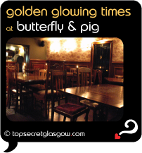 Top Secret Glasgow Quote Bubble showing interior of bar, tables & chairs.
Caption: golden glowing times