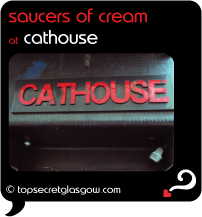 Top Secret Glasgow Quote Bubble, exterior photo of main door.
Caption: saucers of cream