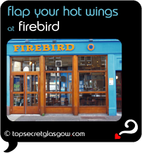 Top Secret Quote Bubble in black, with photo of logo and huge windows. Caption: 'flap your hot wings'