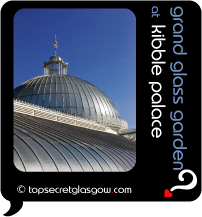 Top Secret Quote Bubble in black, with photo of main dome in sunshine of Kibble Palace. Caption: 'grand glass garden'