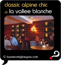 Top Secret Quote Bubble in black, with photo of diners in glowing light. Caption: 'classic alpine chic'