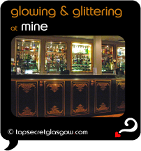 Top Secret Quote Bubble in black, with interior photo of polished, shining bar.  Caption: 'glowing & glittering'
