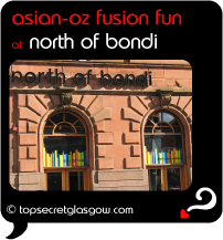 Top Secret Quote Bubble in black, with photo of Byres Road side of building with logo above windows. Caption: 'asian-oz fusion fun'