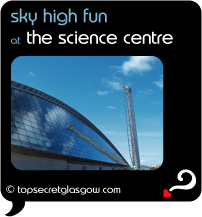 Top Secret Quote Bubble in black, with photo of exterior of Glasgow Science Centre and Millenium Tower, glass reflecting wispy clouds in a bright blue sky.  Caption: 'sky high fun'