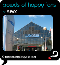 black speech bubble with SECC entrance against blue sky, caption: crowds of happy fans.