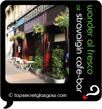 Top Secret Quote Bubble in black, with photo of Stravaigin Cafe Bar's  hanging baskets on sunny day, blue sky with wispy clouds.  Caption: 'lazy brunch days'