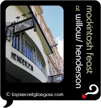 Top Secret Quote Bubble in black, with photo of Henderson exterior, looking up the building to blue sky and with view of signs for Henderson and The Willow Tearoom.  Caption: 'mackintosh feast''